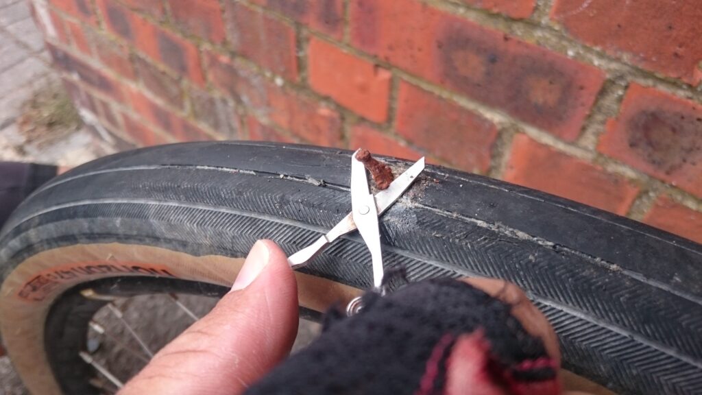 My first tubeless repair - added sealant, tried superglue, in the end manage to plug it with a GI anchovy