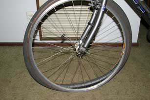 Riding through smashed bottle remains is not a good idea